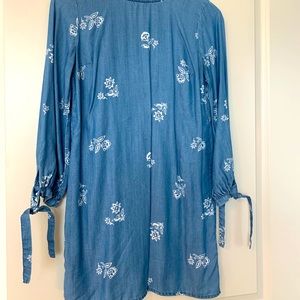 Denim smock dress with floral accents